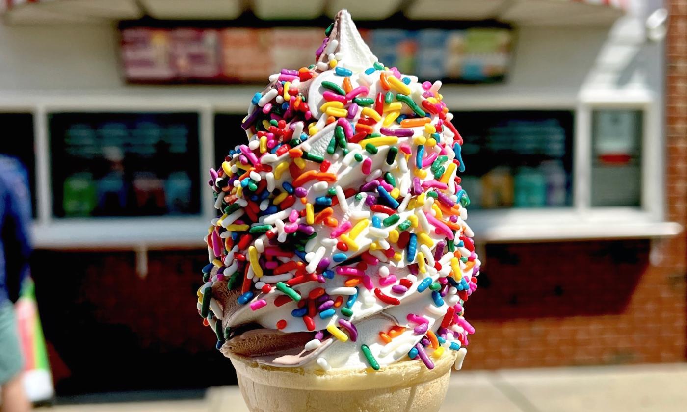 A cone of custard topped with sprinkles