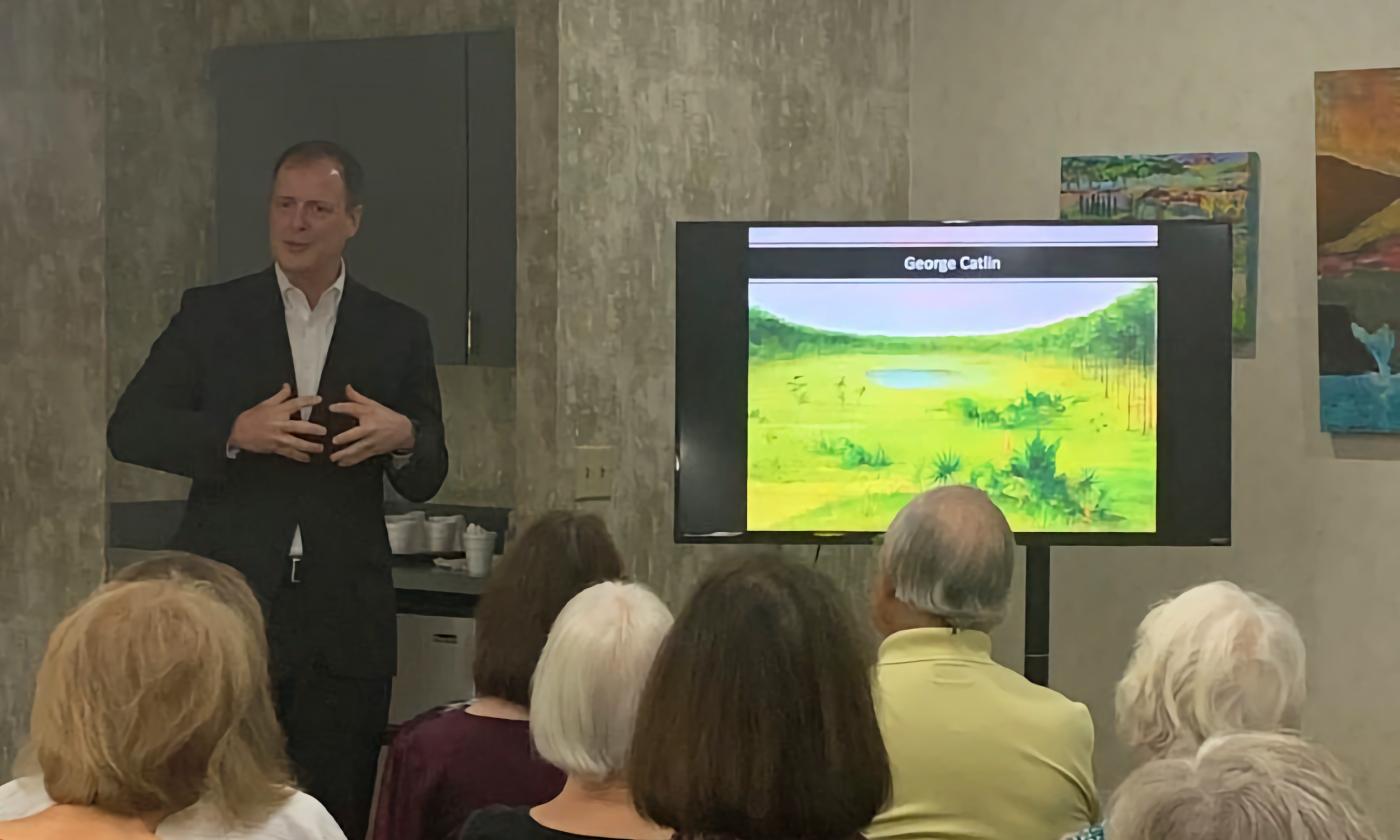 Doctor P. Scott Brown talking during an art lecture