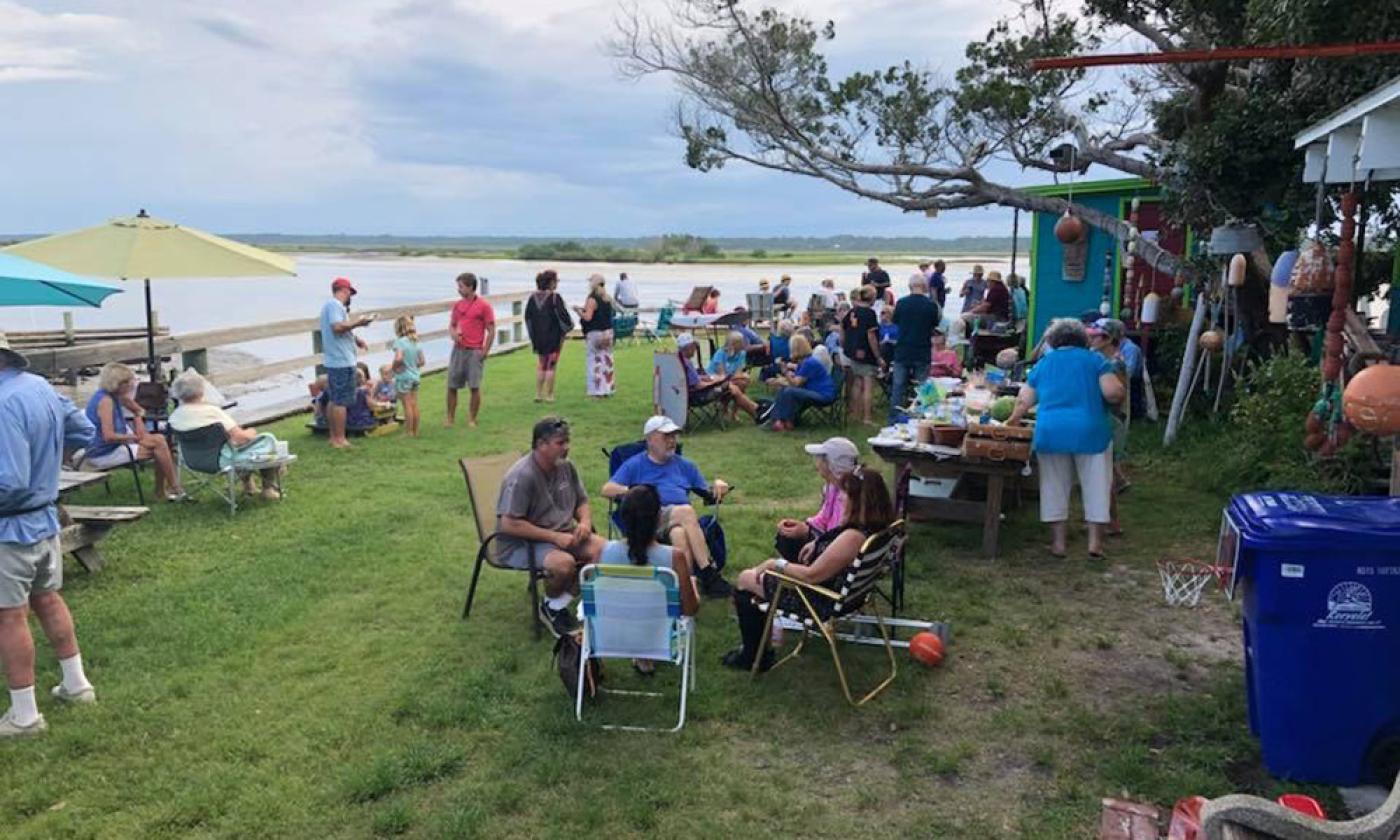 A gathering on the lawn of Genung's Fish Camp, located on the Matanzas River.