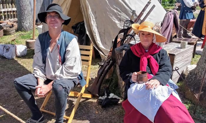 A couple sitting at their tent in the School for 16th Century encampment