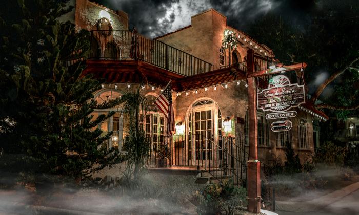 A photo of the exterior of Casa de Suenos, taken at night 