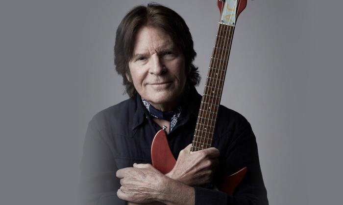 John Fogerty poses with his guitar