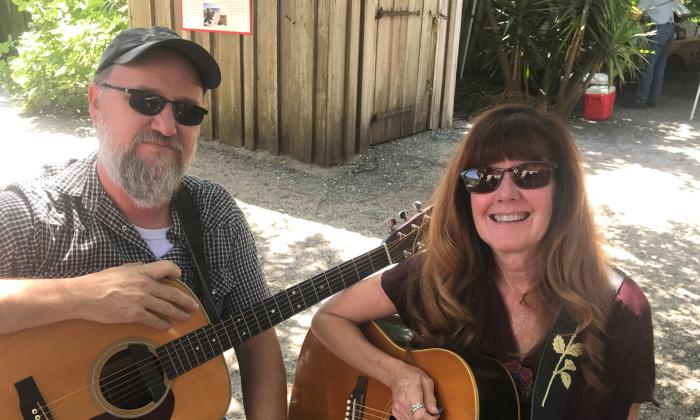 Guitar players Joey Kerr and Lee Hunter smiling between sets in St. Augustine, FL