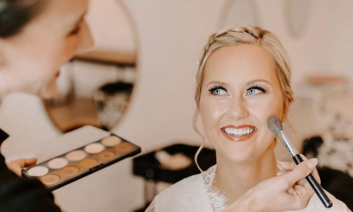 Makeup artist applying finishing touches