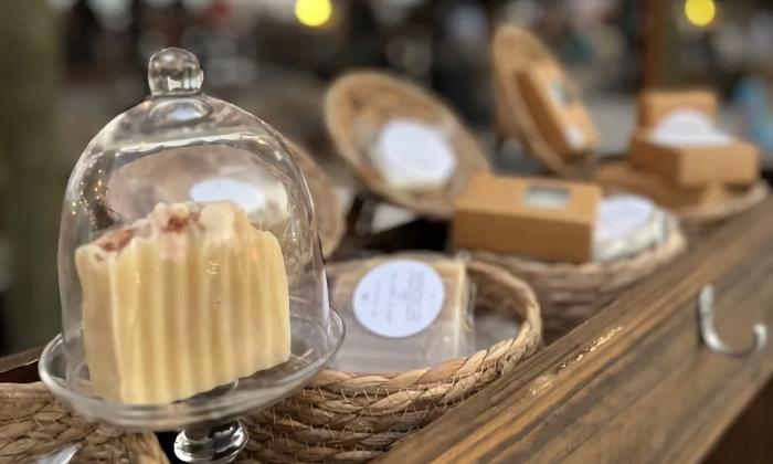 A local vendor sells an assortment of beeswax products at the festival