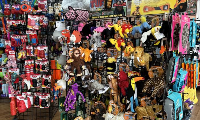 A collection of pet toys on a rack