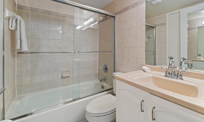 The guest bathroom at "Just Beachy" has a step in tub/shower