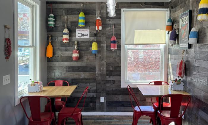 Indoor dining with festive sea decor on the walls