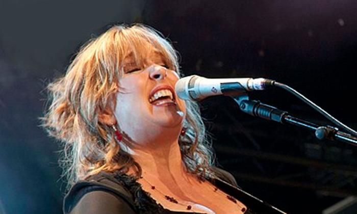 Songwriter Gretchen Peters singing into a microphone