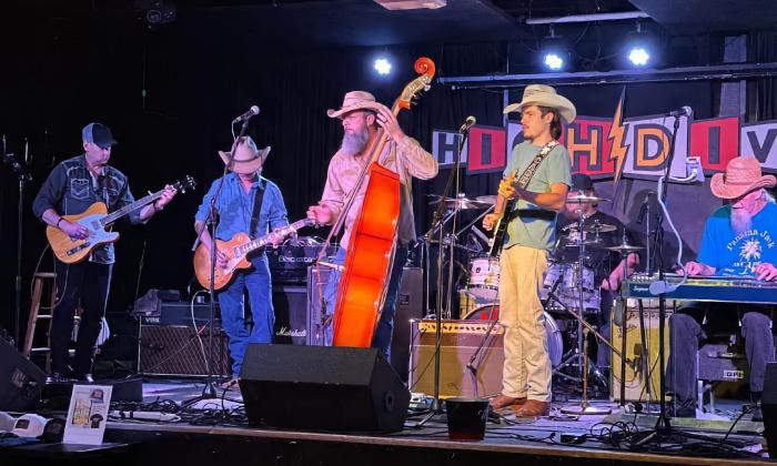 A six-member band country and honky-tonk band on stage