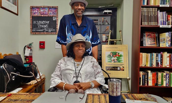 Gigi Best-Richardon smiles alongside her husband, Mr. Richardson, inside the BRADLC Museum.