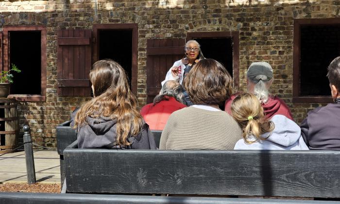 Minerva King speaks with visitors at the Boone Hall Plantation. 