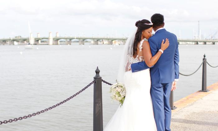 A bridal couple on the bayfront — taken by Amie Ayers