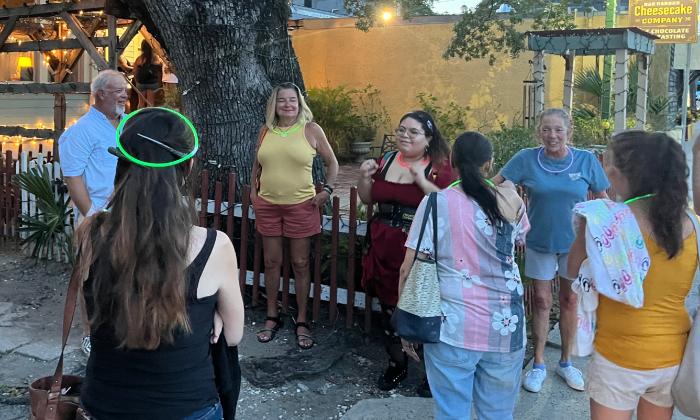 A ghost tour standing by the Love Tree