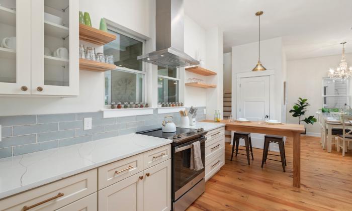 A kitchen at an vacation rental in historic St. Augustine has abundant countertops and an eating island