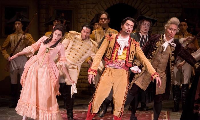 The costumed cast of Barber of Seville performing on stage