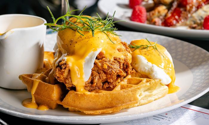 A chicken and waffle eggs benedict dish