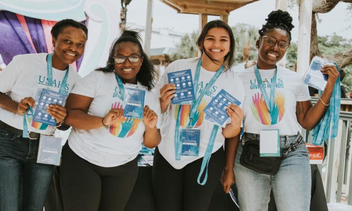 Four young women at the Brave Summit.