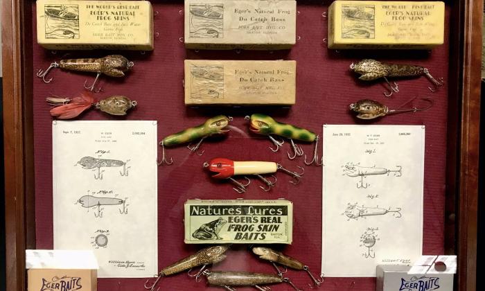 Fishing and tackle memorabilia in a shadow case