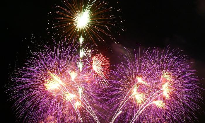 A firework display of various colors and designs