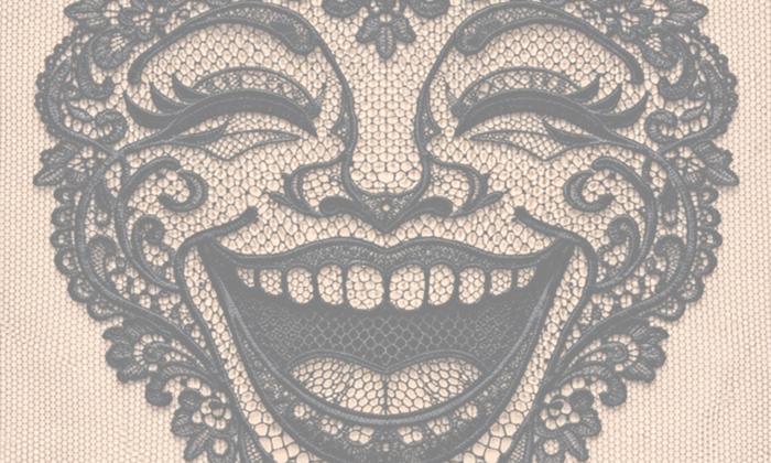a woman's face made out of lace that's laughing