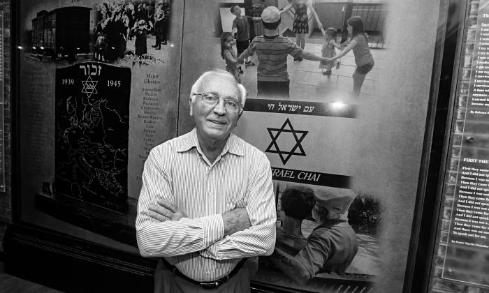 Morris Bendit in front of the memorial he designed