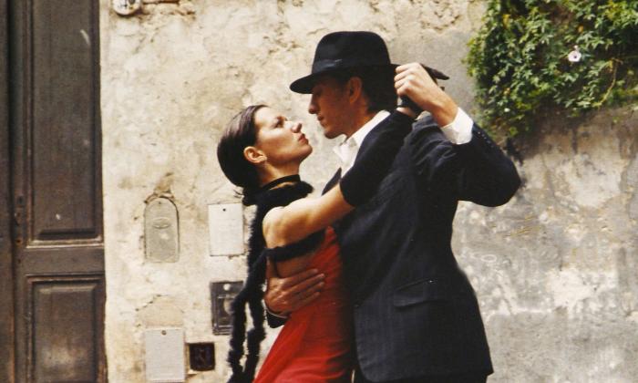 Dance partners performing the cha-cha