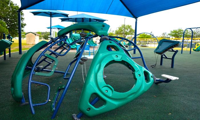 A shaded play area with room for climbing and other activities