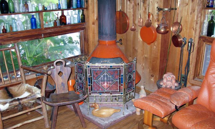 The interior of Kennedy's home with a wood stove in one of the rooms