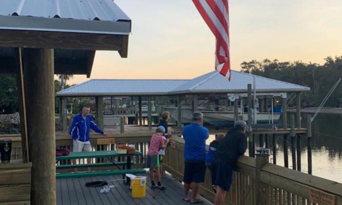 Visitors fishing off the property's pier