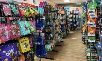 An aisle of various pet snacks and treats