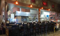 Seating facing the open kitchen at the Chianti Room