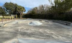 Inside the skate park with various ramp and pipes