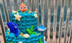 Choco-lattes makes cakes for kids. This is a Finding Nemo cake with bright blue waves plus fish and shells