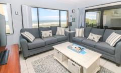 The living room has an ocean view at this vacation rental in St. Augustine