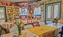 The inside of Maggie's Herb shop with tables and chairs set up