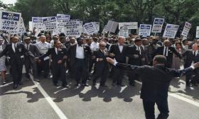 Martin Luther King rallies at a march. 