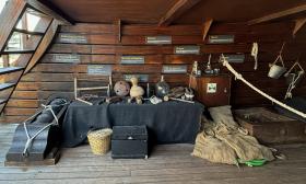 This display on a deck of the Nao Trinidad shows some of the goods, foods, and tools found on a ship in the 1500s