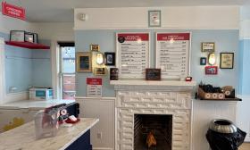 The milkshake and waffle menus hang near the counter space