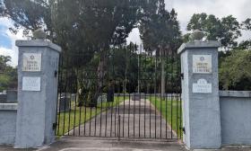 The iron gates of the Sons of Israel Cemetery are designed with a Star of David in each panel