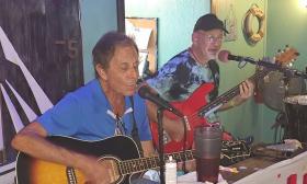 The Bones, a vocal guitar duo, performing in a local pub