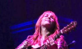 Singer/songwriter Gretchen Peters onstage with guitar