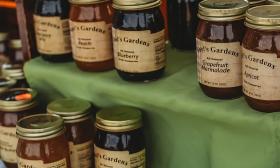 Jars of various marmalade and preserves at a booth at Market on Main Street in Hastings, Florida