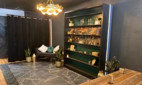 Lounging area with a modern bookcase atop marble flooring