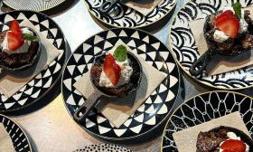 Elegant desserts presented on black and white dinnerware from The Perch