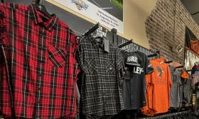 Summer shirts in one of the lines for Harley-Davidson are hanging on a store wall