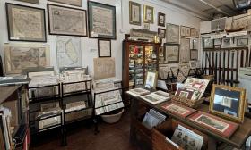 Collections of antique maps spread out