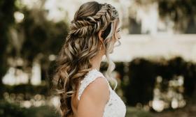 A bride with a curly, braid hairdo