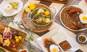 A spread of Columbian food dishes served at De Leon Cocina