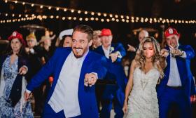 The DJ joins the wedding party on the dance floor